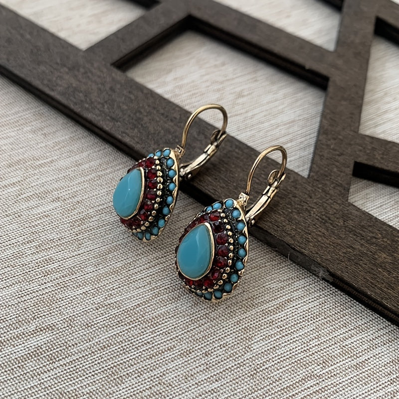 Bohemian bronzen oorbellen met turkoois en rode strass