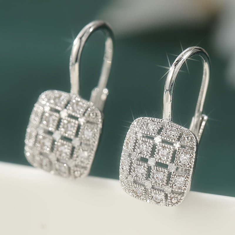 Zilveren vintage oorbellen met geometrisch open vlak en zirkonia