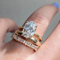 Gouden ring met ovale zirkonia en baguette band