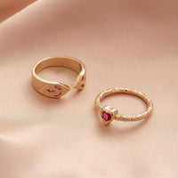 Gouden ringenset met slang en hart met roze zirkonia