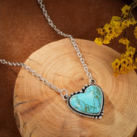 Zilveren tribale oorbellen met turquoise druppels