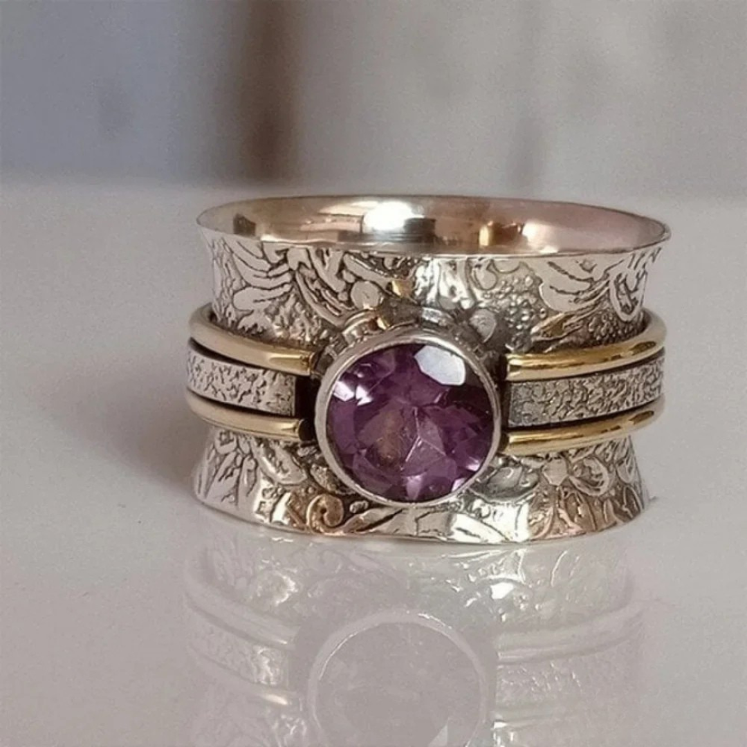 Zilveren spinner ring met paarse amethist