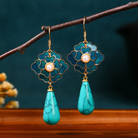 Vintage oorbellen met turquoise bloem en druppelhanger