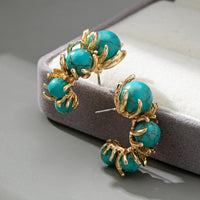 Gouden ring met ovale turquoise edelsteen