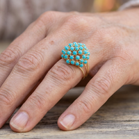 Gouden ring met turquoise bloemcluster