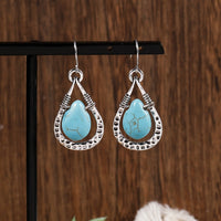 Zilveren oorbellen met wire-wrapped turquoise druppel