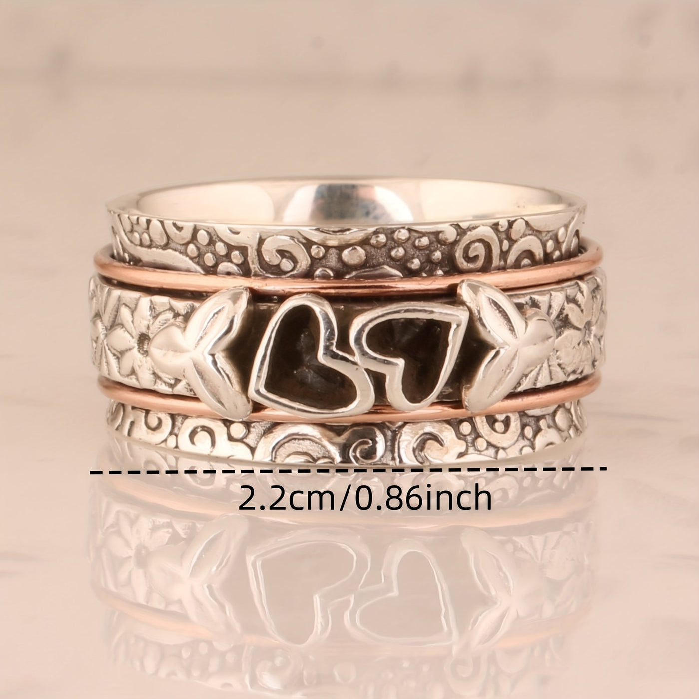 Zilveren spinner ring met hartjes en bloemen
