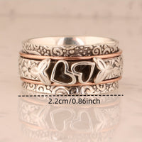 Zilveren spinner ring met hartjes en bloemen
