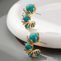 Gouden ring met ovale turquoise edelsteen