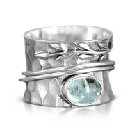 Zilveren spinner-ring met aquamarijn en bladmotief