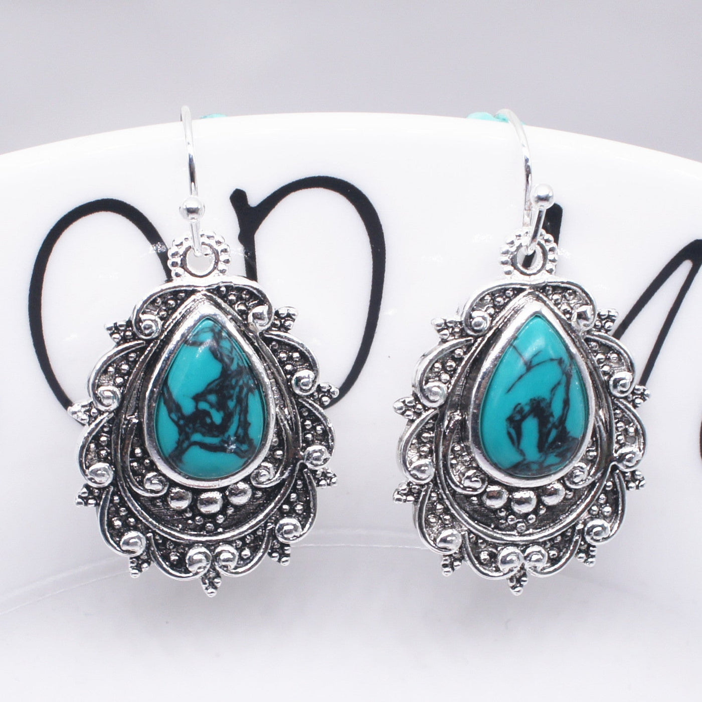 Zilveren vintage filigraan oorbellen met turquoise druppel
