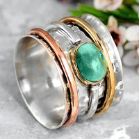 Zilveren spinner ring met turquoise edelsteen