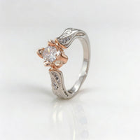Tweekleurige zilveren en roségouden ring met zirkonia
