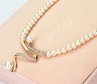 Gouden parelsieradenset met ketting en oorbellen