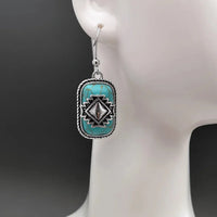 Bohemian zilveren oorbellen met turquoise en Azteeks motief