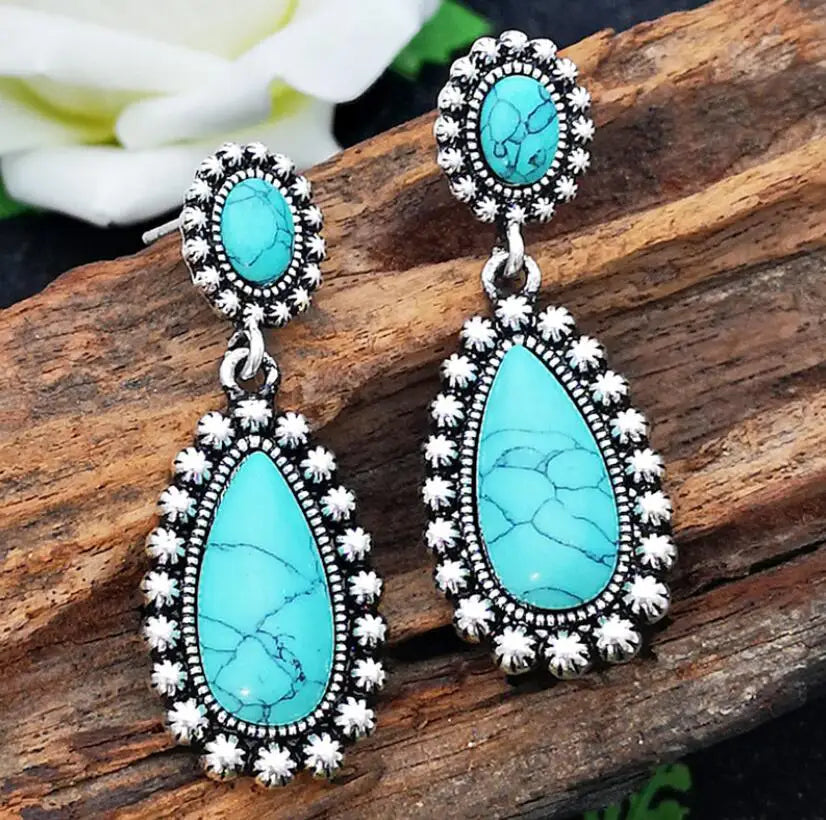 Western zilveren hangoorbellen met turquoise druppel