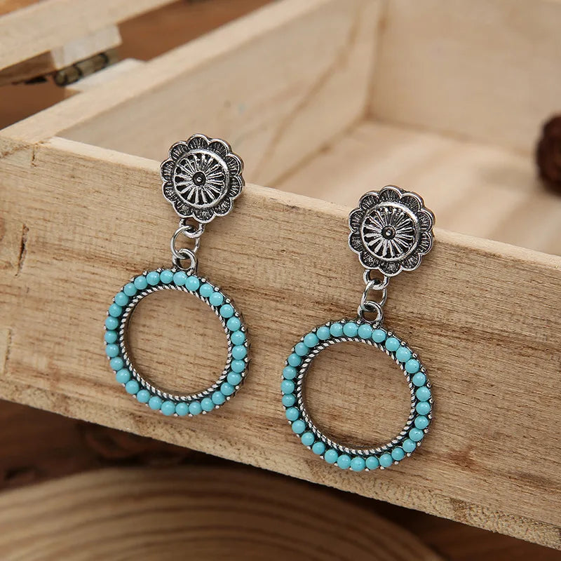Zilveren vintage oorbellen met turquoise kralenring