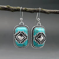 Bohemian zilveren oorbellen met turquoise en Azteeks motief