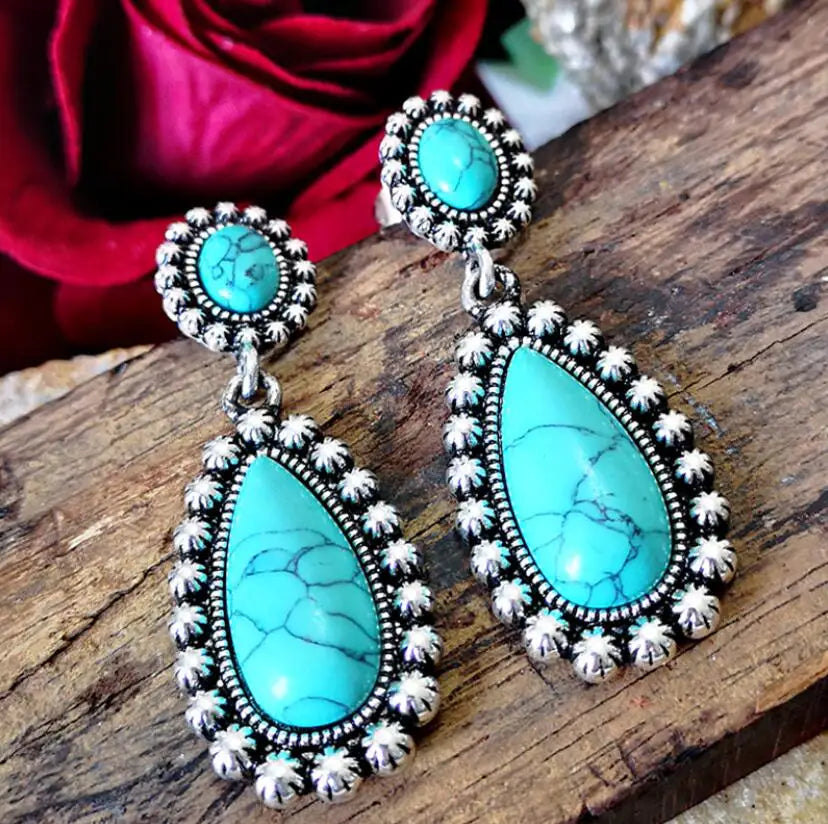 Western zilveren hangoorbellen met turquoise druppel