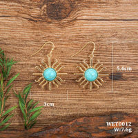 Gouden bohemian oorbellen met turquoise zon