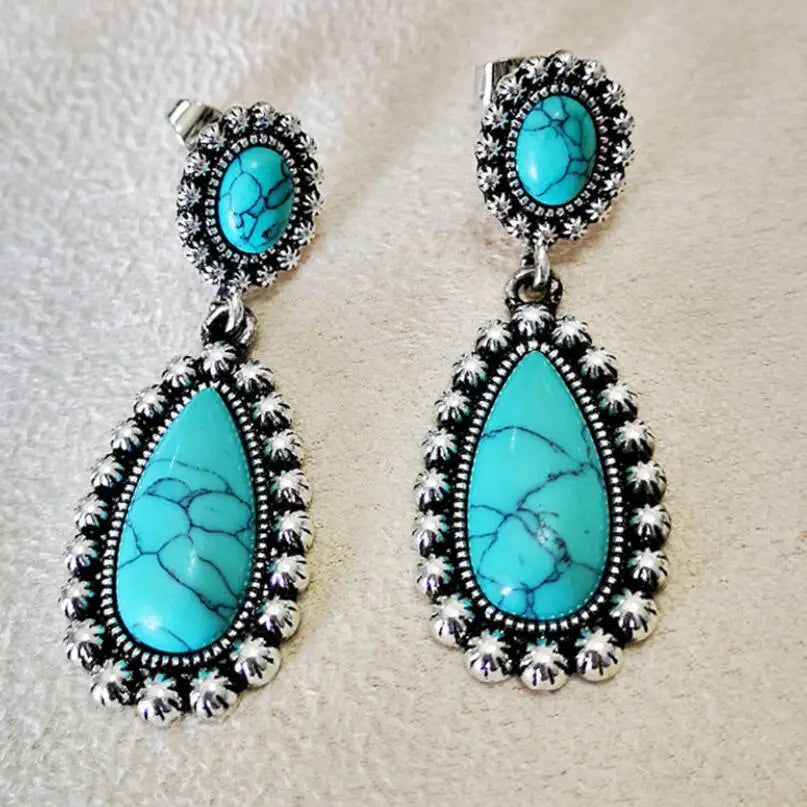 Western zilveren hangoorbellen met turquoise druppel