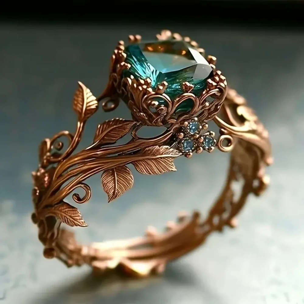 Roségouden vintage ring met groene edelsteen en bladmotief