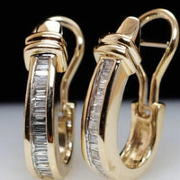 Gouden oorbellen met baguette zirkonia en omega-sluiting