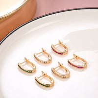 Gouden oorbellen met groene zirkonia