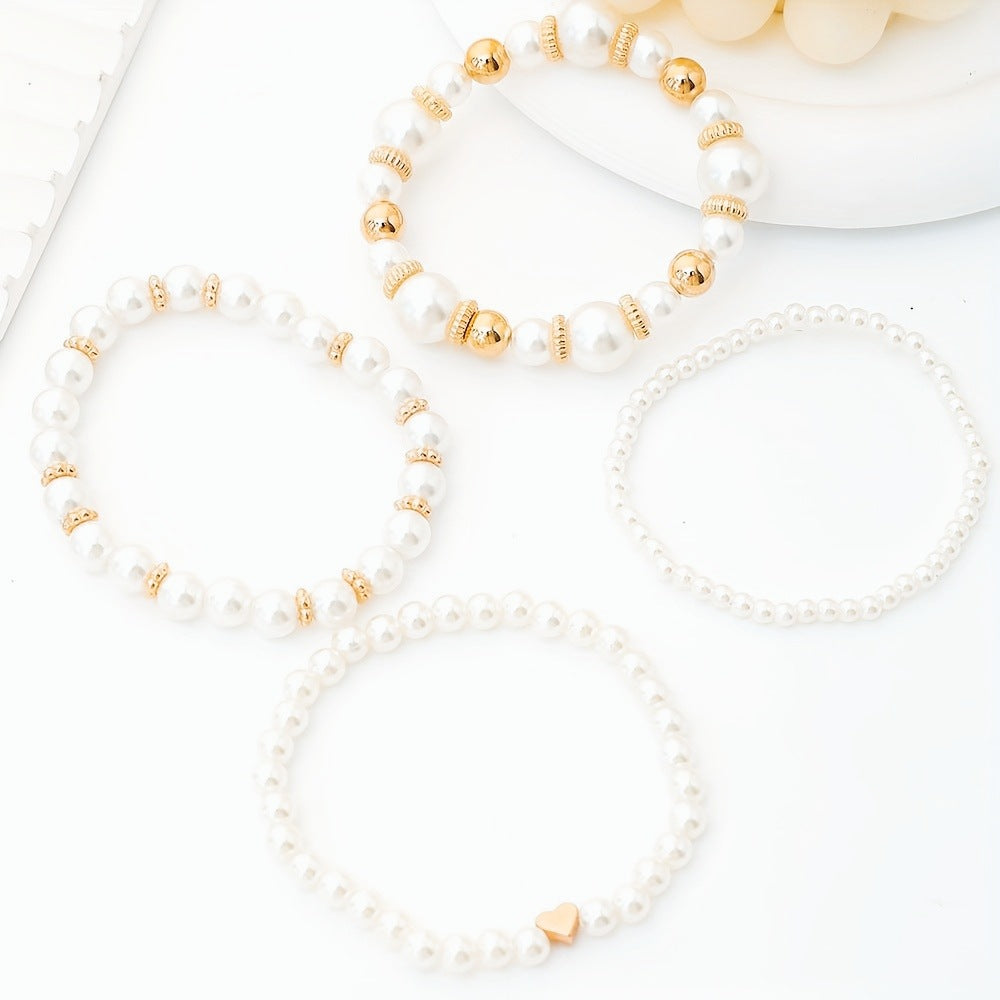 Parel armbandenset met gouden accenten en hartje