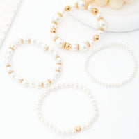 Parel armbandenset met gouden accenten en hartje