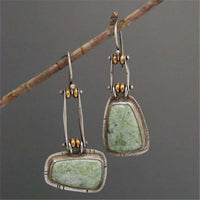 Zilveren vintage oorbellen met groene edelsteen