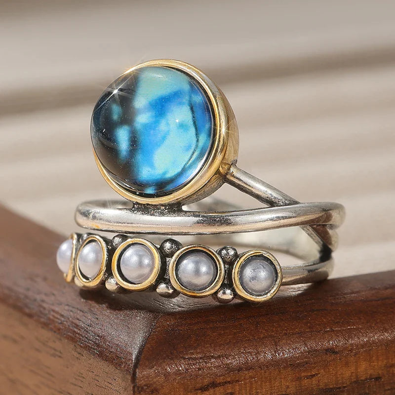 Zilveren ringenset met blauwe steen en parels