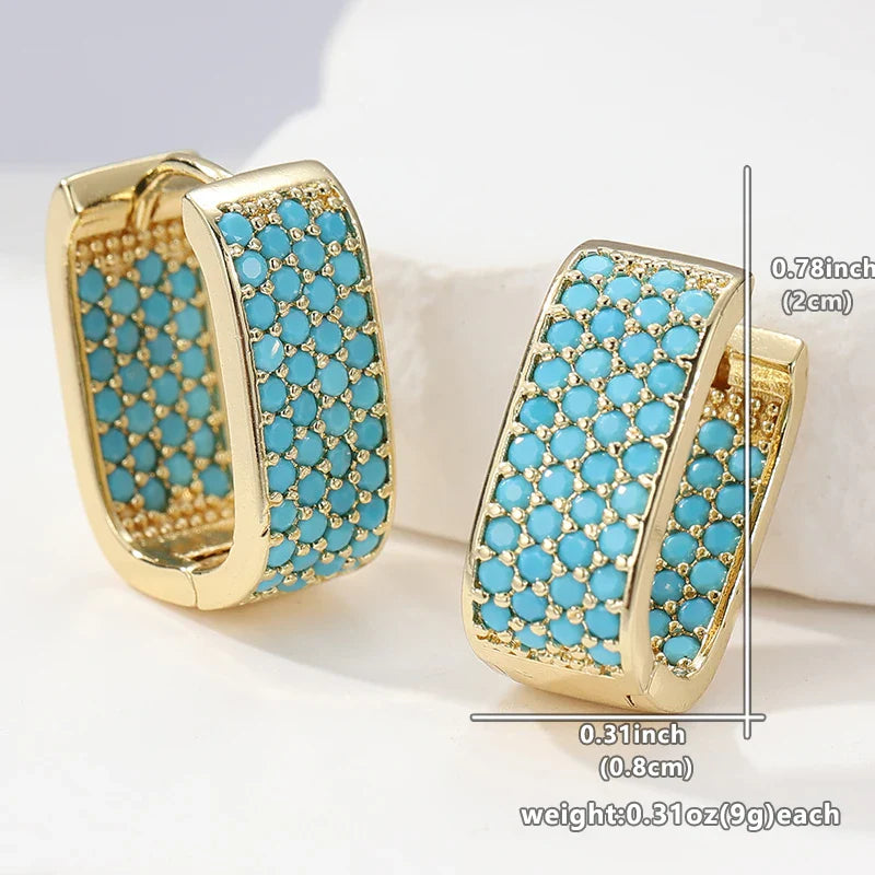 Gouden huggie-oorbellen met turquoise pavé