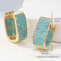 Gouden huggie-oorbellen met turquoise pavé