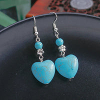 Zilveren oorbellen met turquoise hart