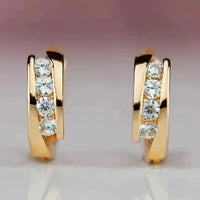 Gouden huggie oorbellen met zirconia