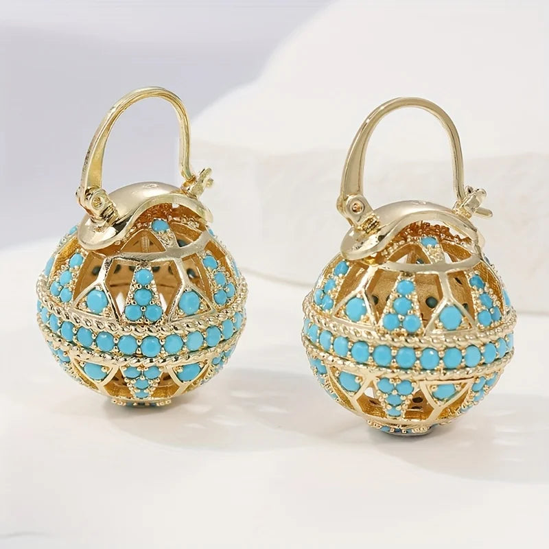 Gouden bolhanger-oorbellen met turquoise kralen