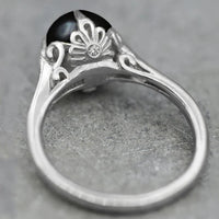 Gouden ring met grijze parel en kristallen