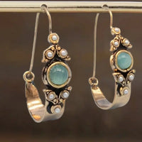 Vintage oorbellen met groene steen en parels