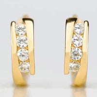 Gouden huggie oorbellen met zirconia