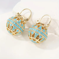 Gouden bolhanger-oorbellen met turquoise kralen