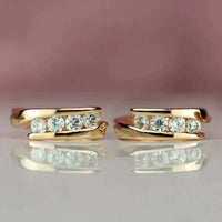 Gouden huggie oorbellen met zirconia