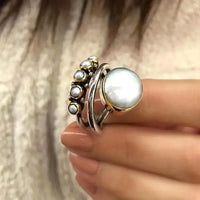 Zilveren ring met parels en gouden accenten