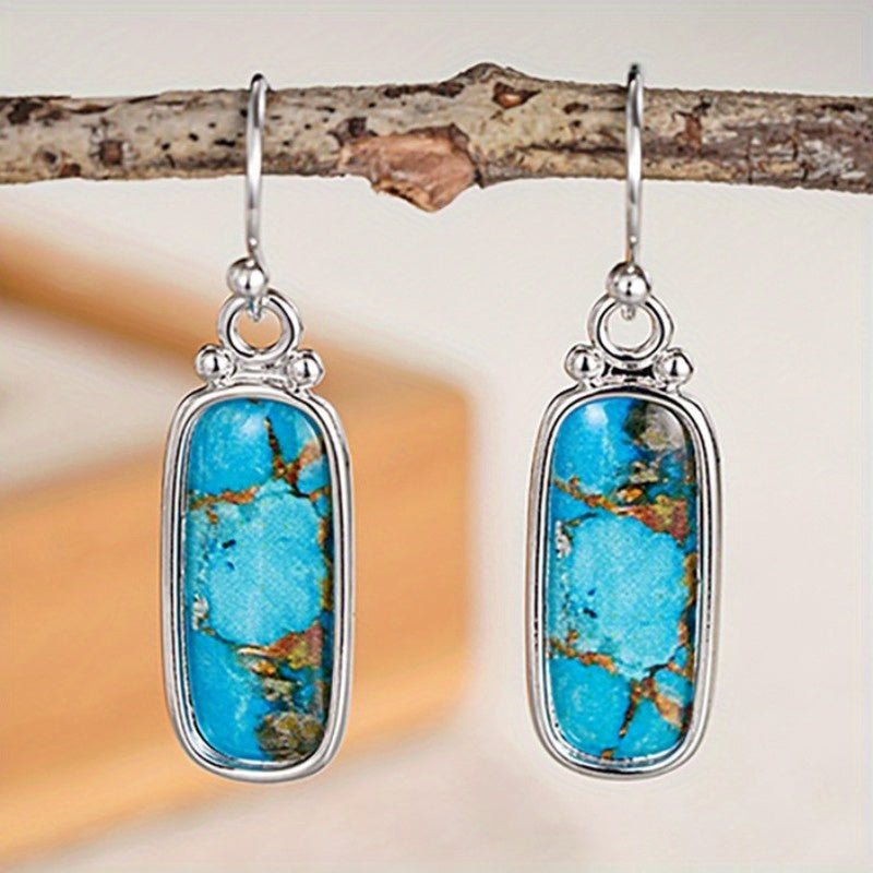 Zilveren oorbellen met rechthoekige turquoise steen