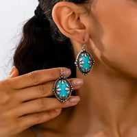 Zilveren ovale oorbellen met turquoise edelsteen