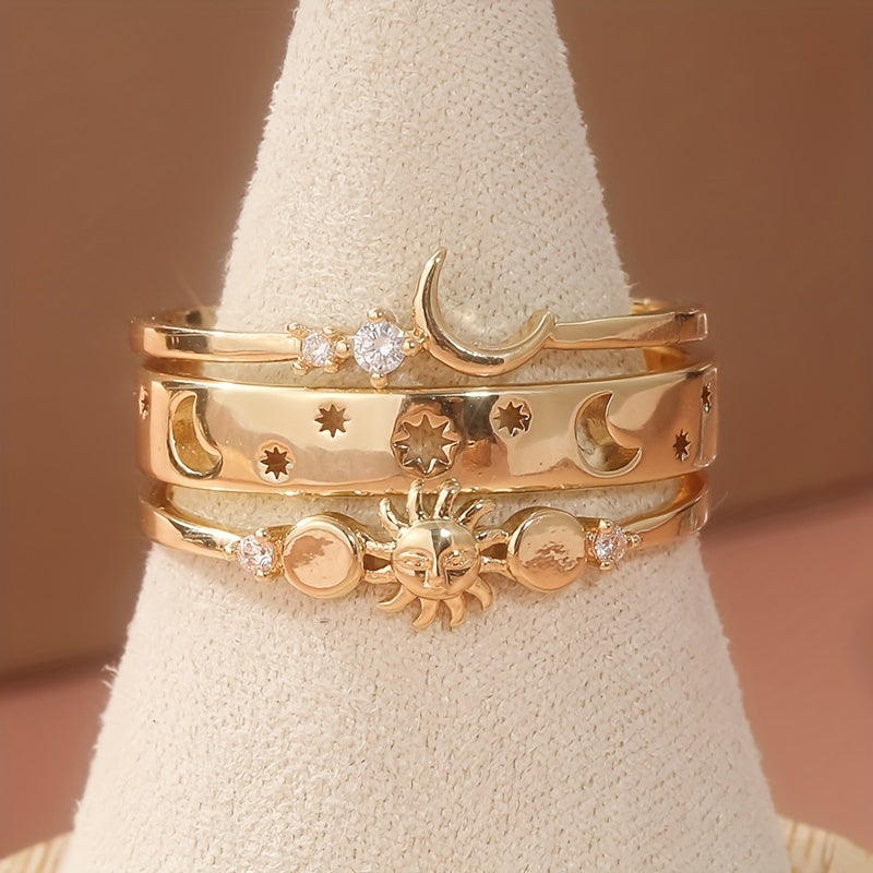 Gouden ringenset met zon, maan en sterren