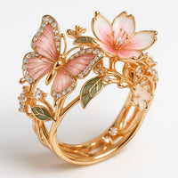 Roségouden ring met roze vlinder en bloemen