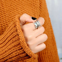 Zilveren spinner-ring met aquamarijn en bladmotief