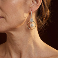 Zilveren en roségouden oorbellen met diamant
