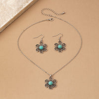 Zilveren bloemenset ketting en oorbellen met turquoise